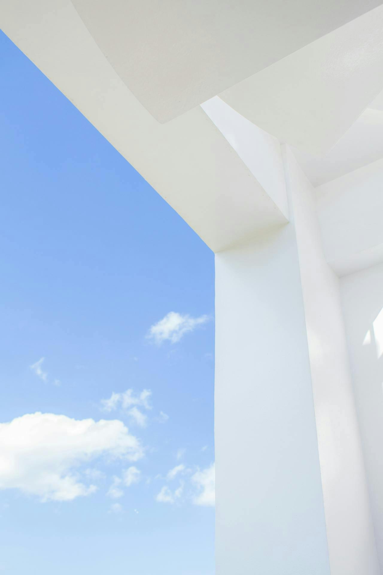 simplicity image of a white building and a blue sky